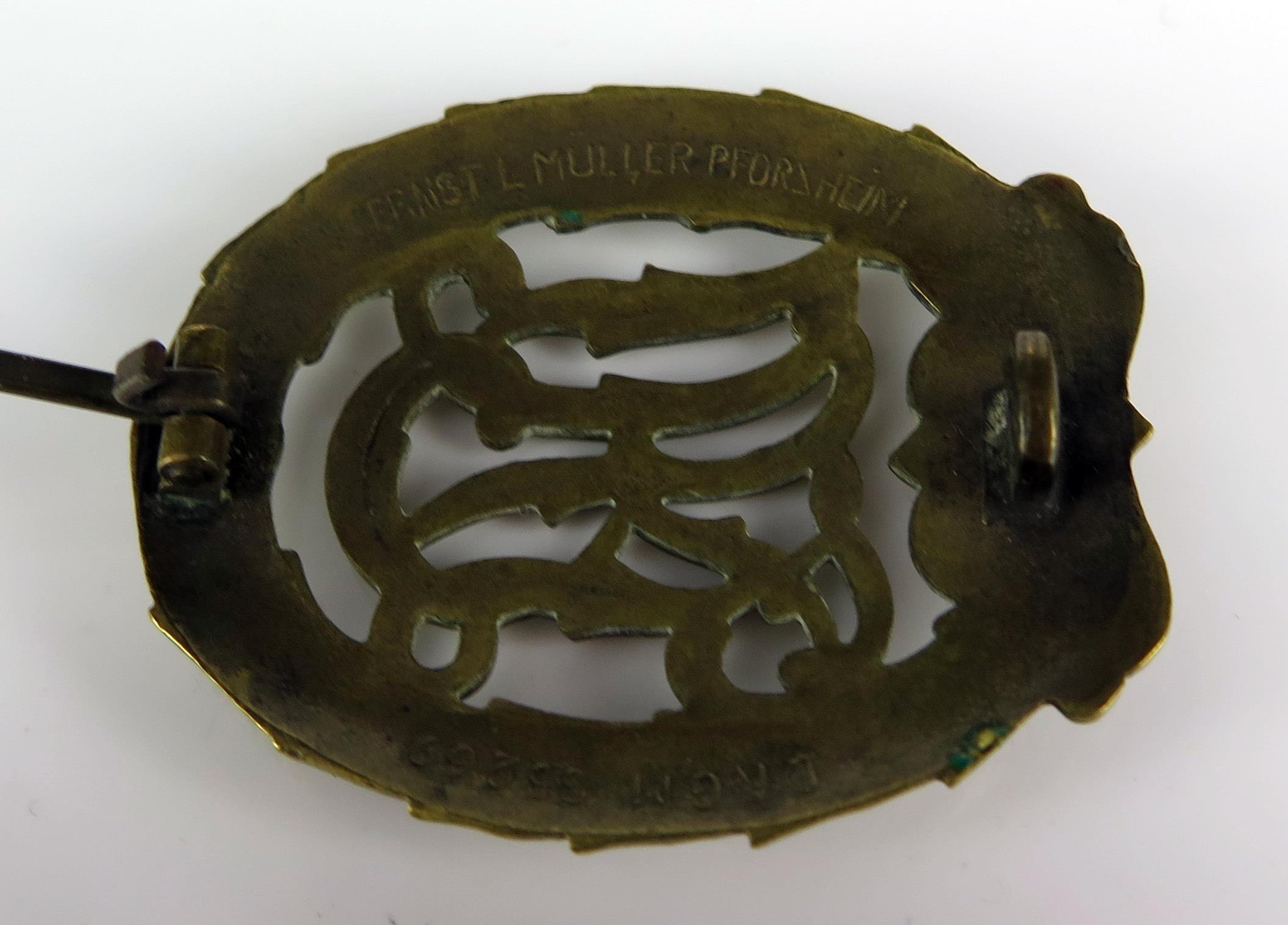 A Third Reich period sports badge , marked to the reverse DRGM 35269, Ernst L Muller Pforsheim, - Image 3 of 3