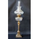 An Edwardian brass and glass oil lamp, the Corinthian column on plinth step base, chimney, shade and