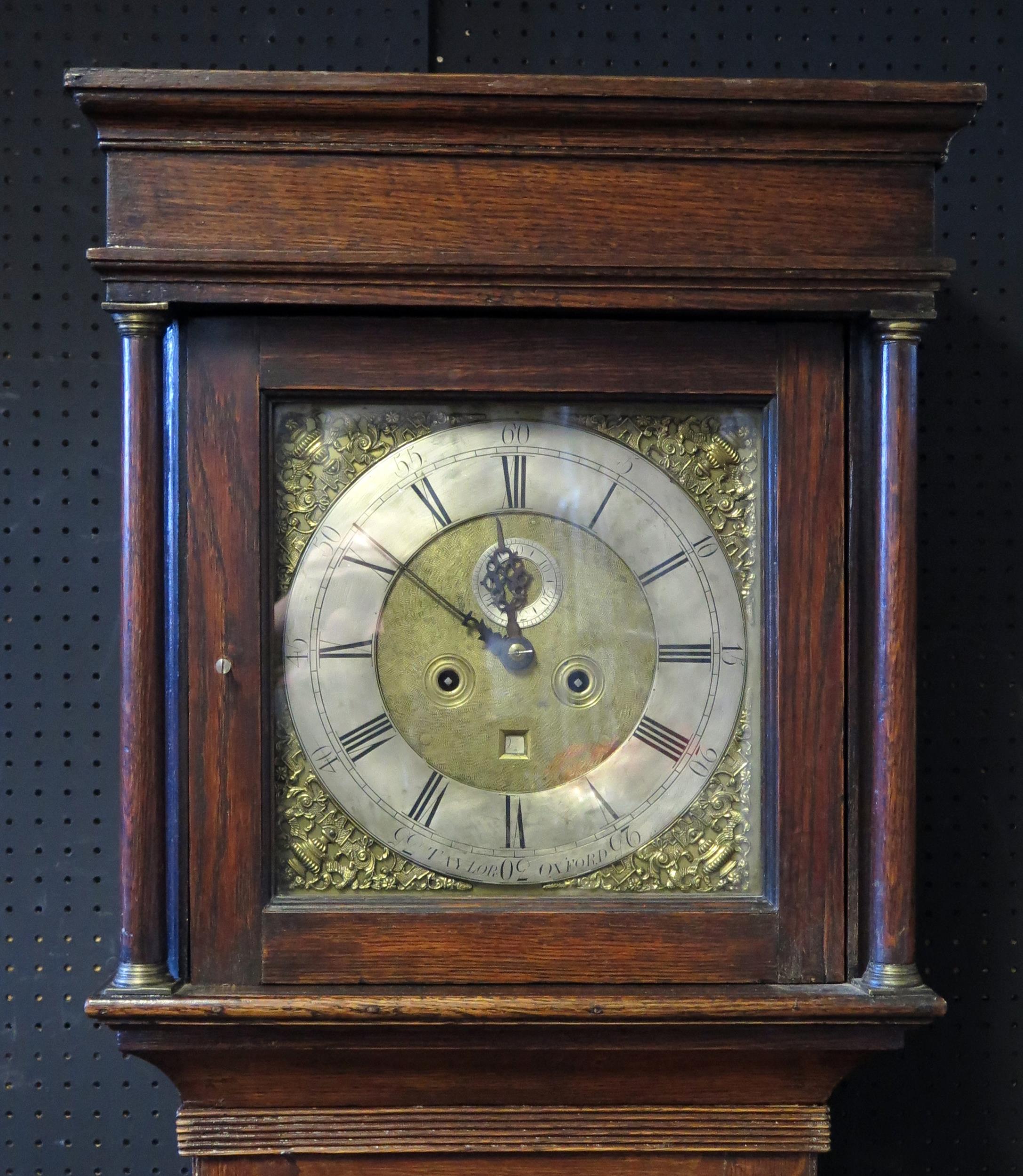 Taylor Oxford, a 19th century oak longcase clock, having a square hood, the trunk with plain panel - Image 6 of 6