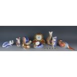 A collection of nine Royal Crown Derby paperweights, modelled as assorted animals and birds