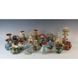 A collection of Aller Vale and other Torquay pottery wares including posy holders, bottle flask,