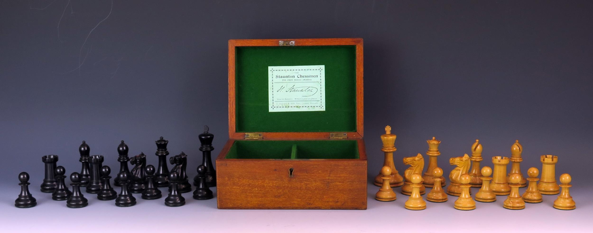 Jaques, London, a boxwood and ebonised Staunton pattern weighted chess set, the black king stamped