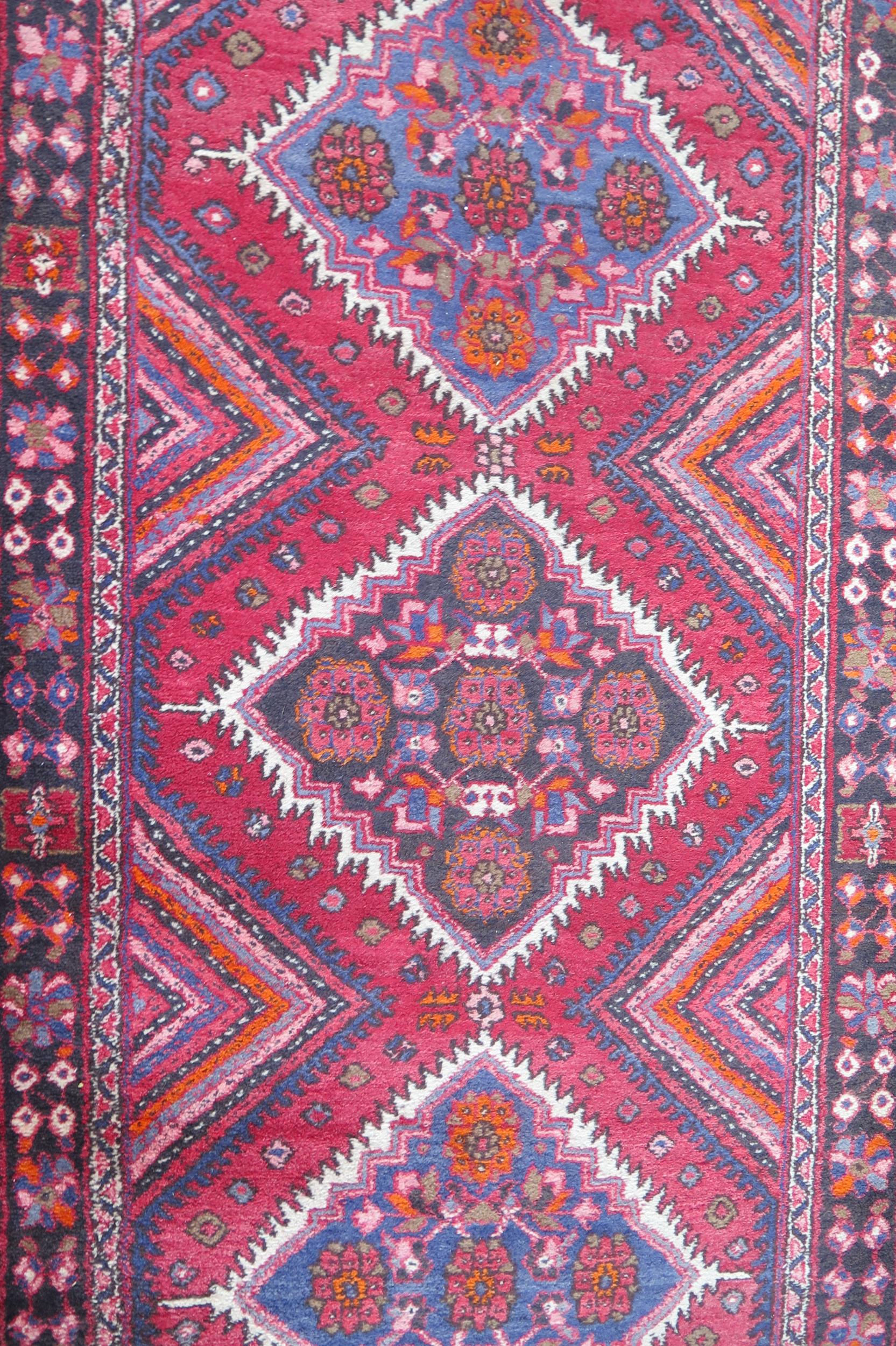 A large 20th Century Turkish Runner, wool carpet, geometric diamond lozenges, red ground, pyramid - Image 6 of 7