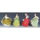 Four Royal Doulton figurines, HN1934 Autumn Breezes, HN2368 Fleur, HN2193 Fair Lady and HN 2329