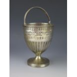 A George III silver swing handled cream pail, maker IB, London, 1803, of ovoid form with reeded