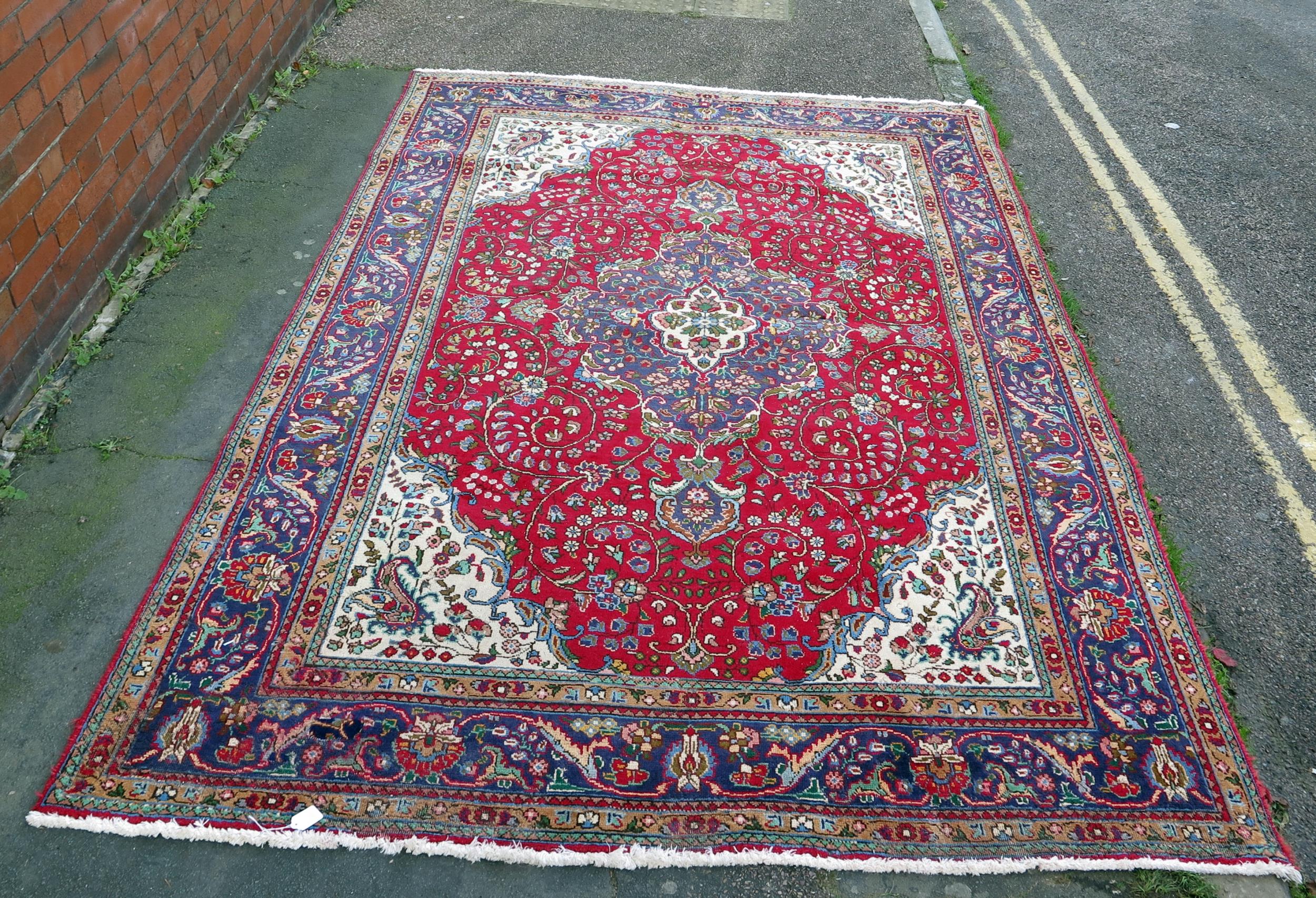 A 20th Century Kashan style wool carpet, blue central medallion, red field, cream spandrels, blue - Image 6 of 6