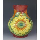 A Moorcroft pottery vase of ovoid form, with Inca pattern with sunflower decoration, 24cm high.