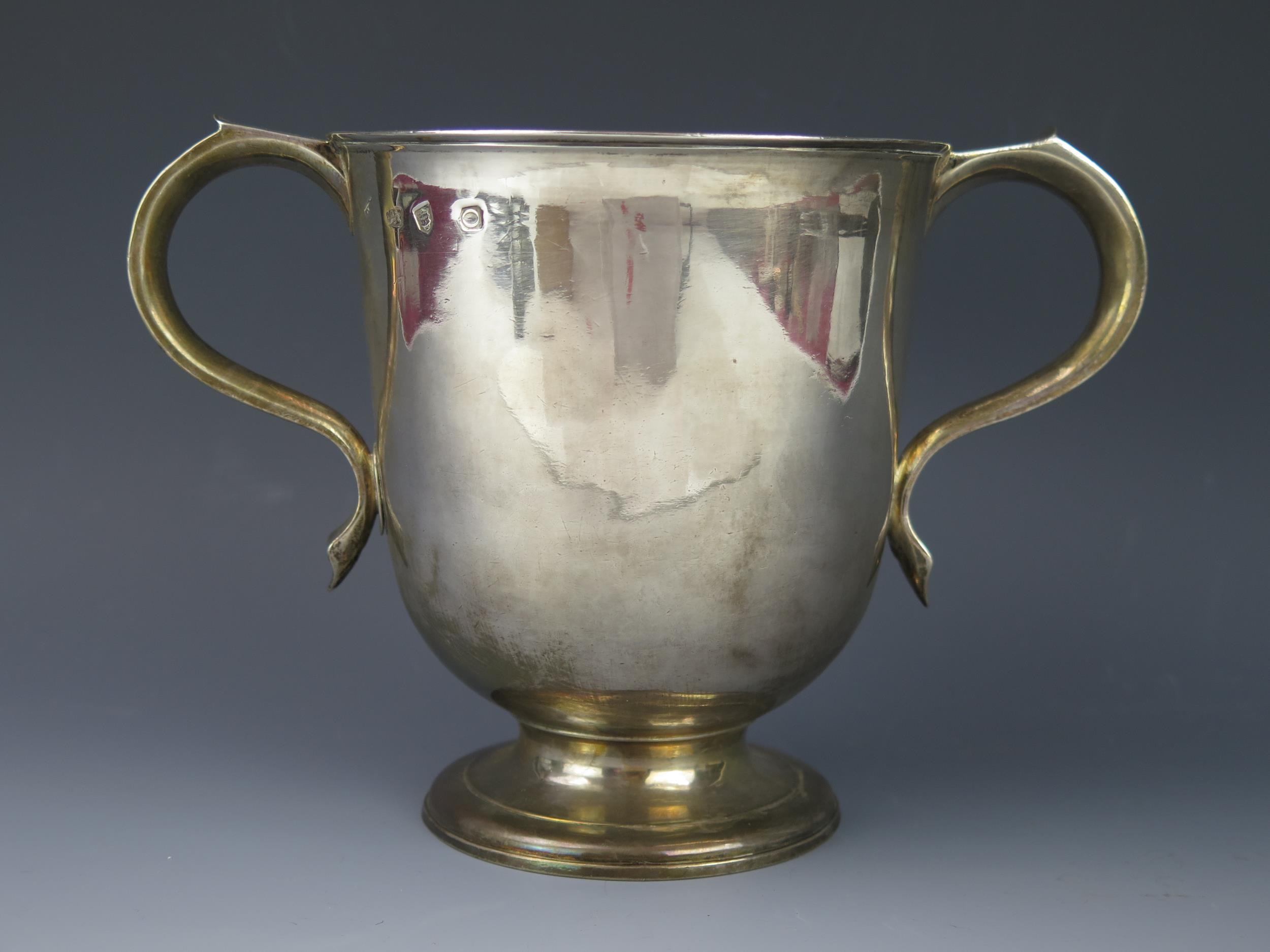 A George II silver twin handled loving cup, makers mark worn, London, 1729, initialled, with