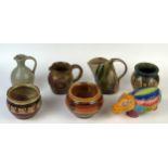 A small collection of studio pottery jugs and bowls by various makers, together with a polychrome