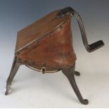 A pair of cast iron and leather foot bellows, 42cm wide.