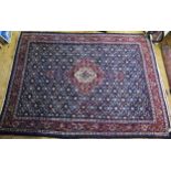 A Persian Mood carpet, with central field with ivory and wine red pole medallion and all over