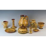 A collection of Aller Vale motto wares includes hat pin holder, water and cream jugs, etc