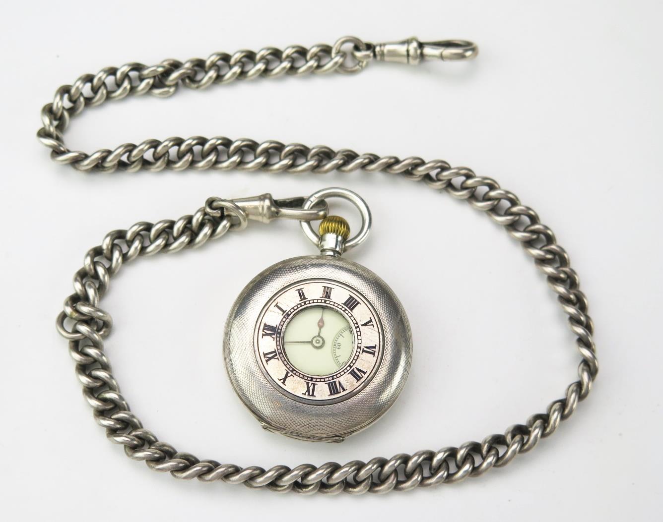 A Ladies continental silver cased half hunter pocket watch, with 2.75cm Roman dial and subsidiary