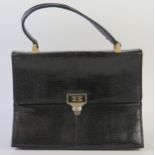A Mappin & Webb patent leather handbag, 25cm wide.