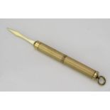 A 9ct Gold Tooth Pick, with engine turned decoration, 5.5cm long 6.7g.