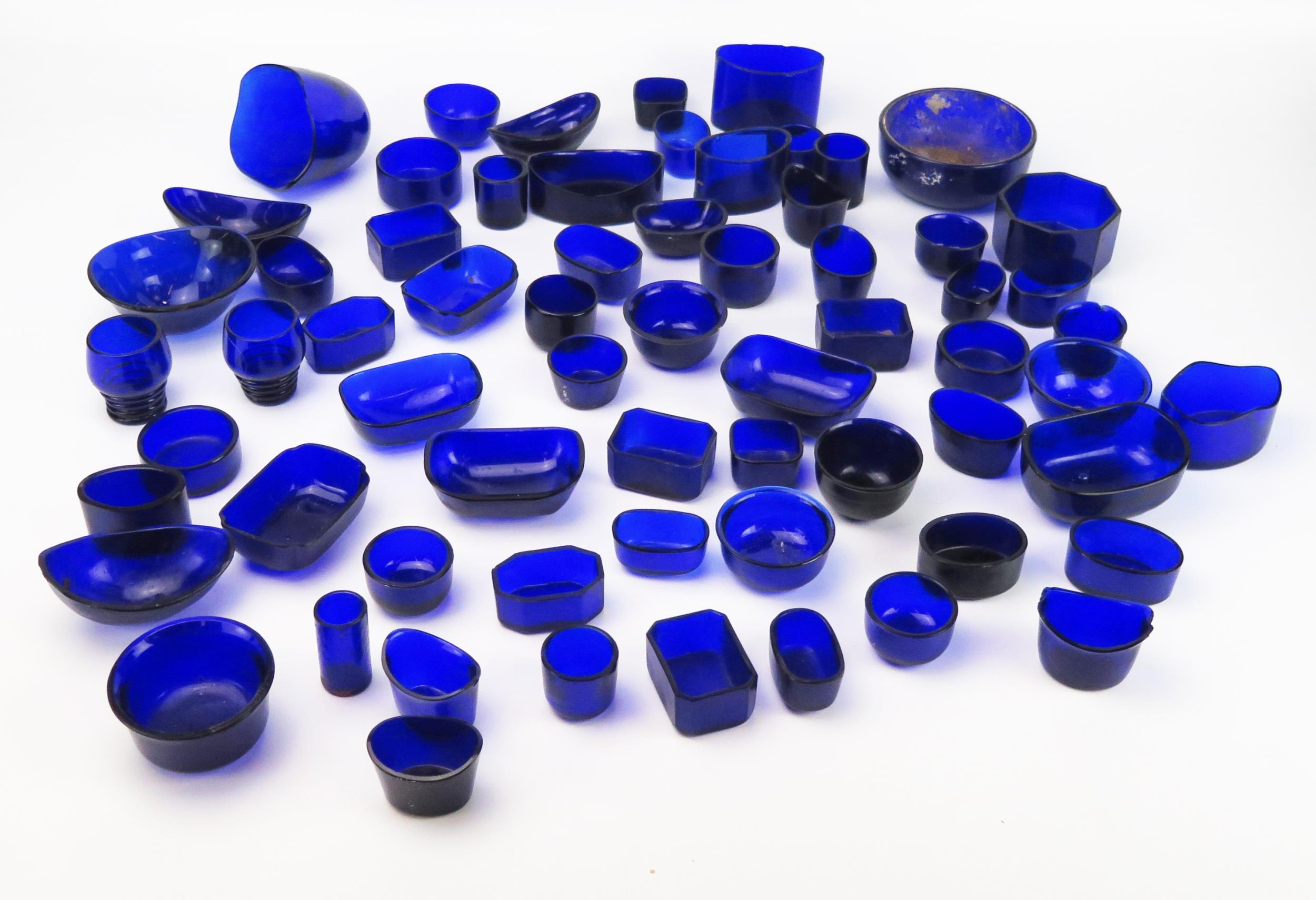 A quantity of assorted blue glass liners, various shapes and sizes, (a lot).