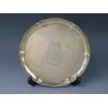 A George III silver salver, maker I.C, London, 1774. bears armorial, of circular form, with beaded