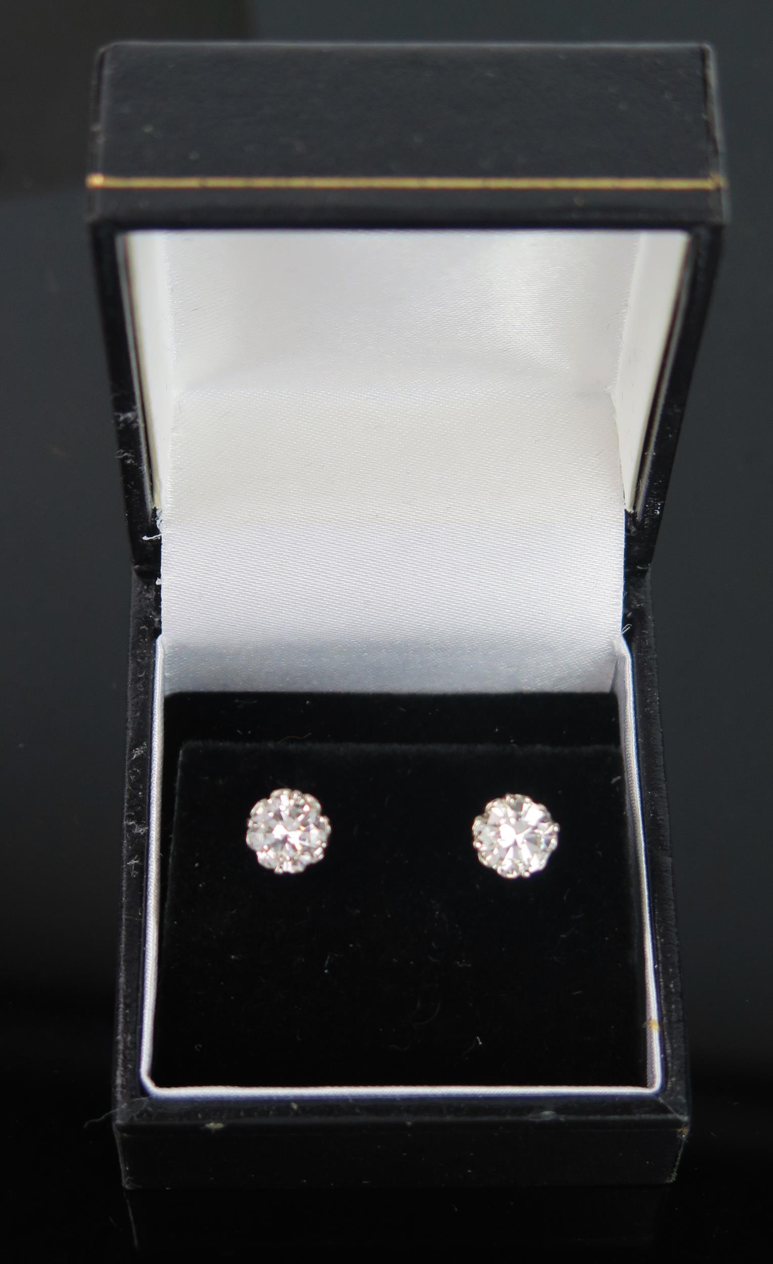 A Pair of Diamond Stud Earrings, 18ct white gold clips stamped 750, EDW 1.5ct, 2.8g - Image 4 of 4