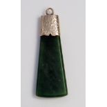 Antique Nephrite Axe Shaped Pendant in an unmarked gold setting with chased foliate decoration, 51.