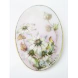 An Antique Porcelain and 9ct Gold Brooch Signed, the oval porcelain plaque held in a gold mount,