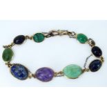 Multi Stone Scarab Beatle Bracelet in a 9ct stamped setting set with amethyst, lapis lazuli, jadeite