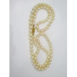 Cultured Pearl Necklace with a hallmarked 9ct gold clasp, pearls c. 7mm, 37.7g