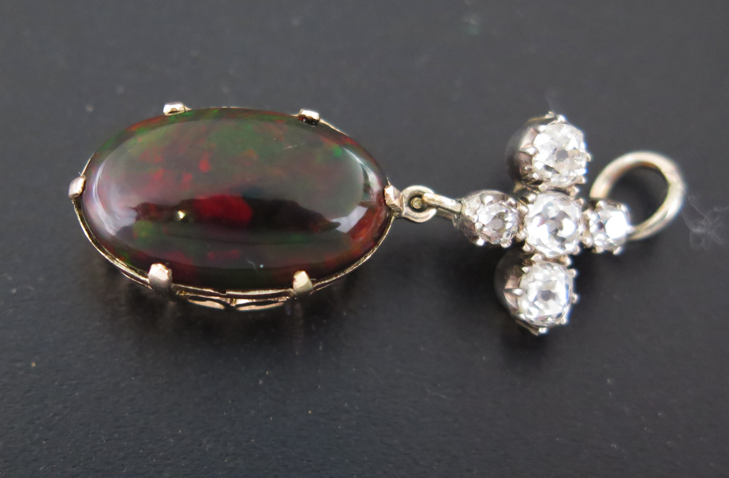 An Opal and Diamond Pendant, the diamond cross suspension above an oval opal 16x10mm - Image 4 of 5