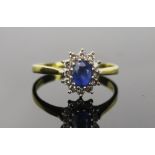 Sapphire and Diamond Cluster Ring in an 18ct hallmarked setting, 11x9mm head, size P.5, 3.1g