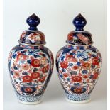 Pair of Imari Palette Cases and Covers, the oversize globular finials above domed the domed lid, the