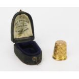 An Antique 9ct Gold Thimble and Case, hallmarked Chester, 3.5g.
