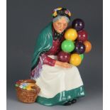 A Royal Doulton figurine HN1315 The Old Balloon Seller, 20cm high.