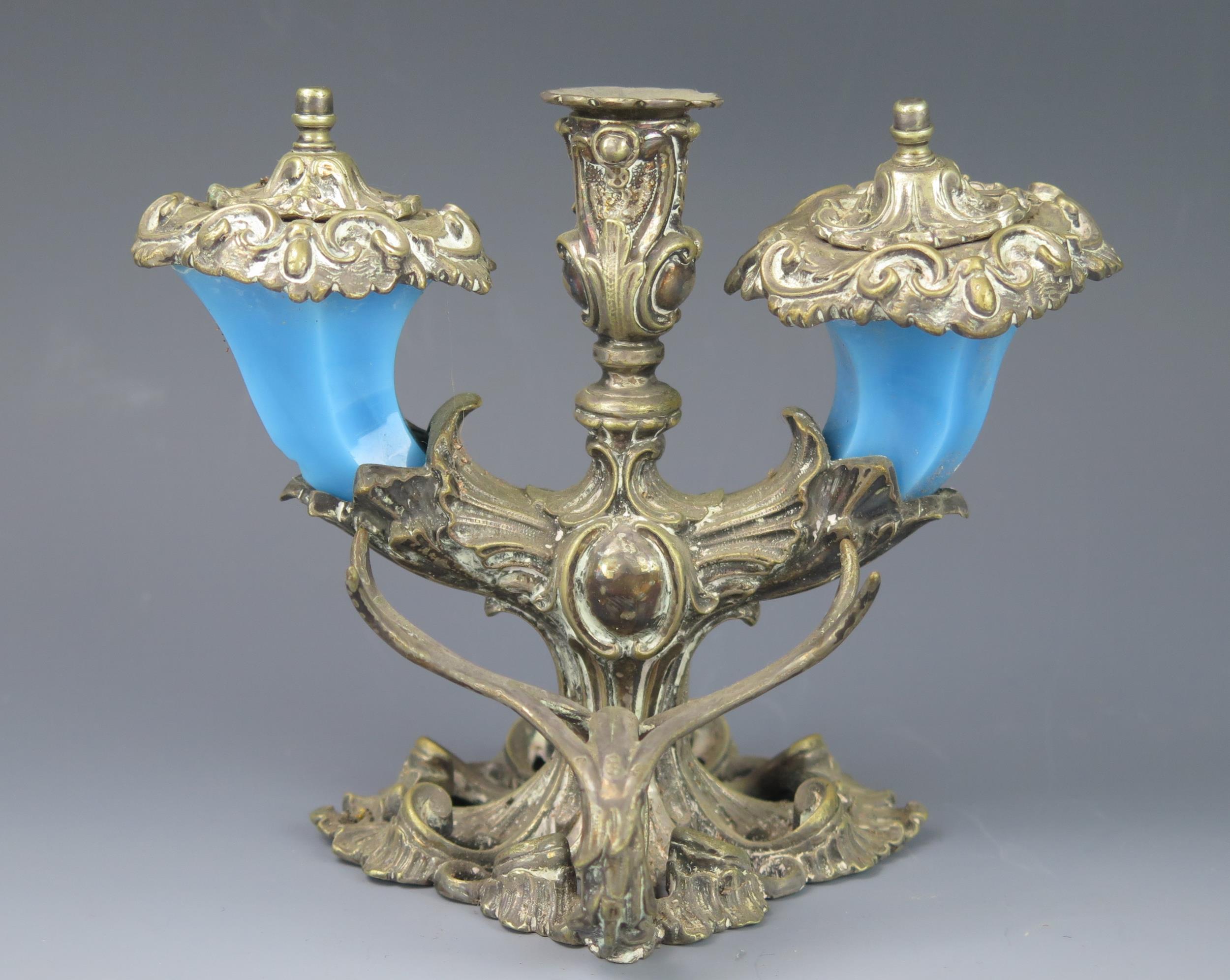 A late 19th century inkstand of floral design, with central taperstick flanked by two blue glass