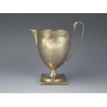 A George III silver pedestal cream jug, maker Henry Chawner, London, 1791, with reeded rim, and