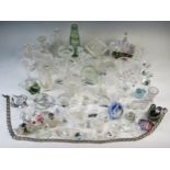 An extensive collection of assorted glass novelties, including paperweights, candlesticks, vases,