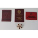 A Russian Order of the Patriotic War star, No 1104712, with document and two other Russian