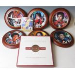A set of six Danbury Mint limited edition Michael Jackson King of Pop plates, together with a CD
