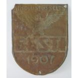 A pressed tin firemark, Kindlustusselts, Eesti, 1907, of shield-shaped outline with winged eagle,