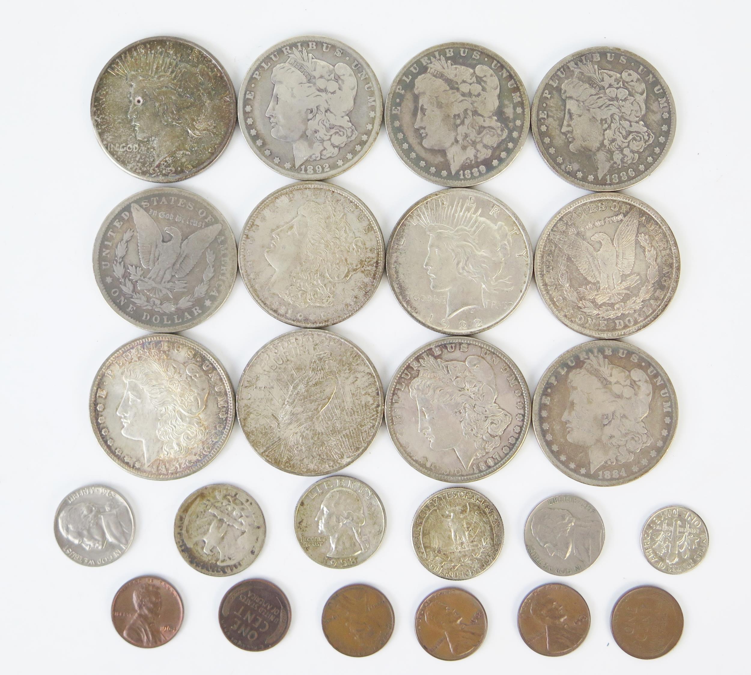 Twelve USA American Dollars including 1884, 1886, 1889, 1892, 1896, 1897 and others. Appear to be