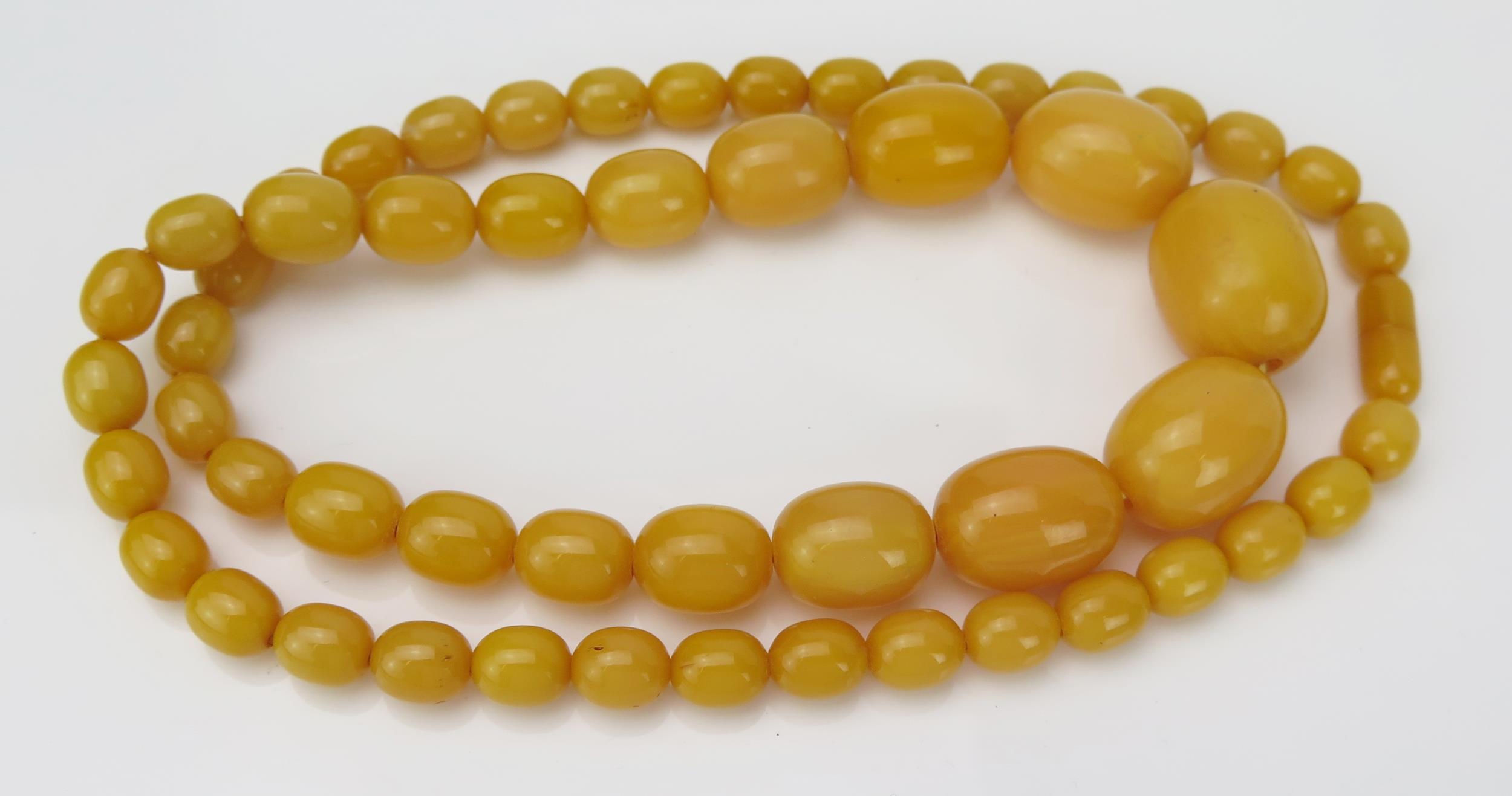 A Butterscotch Yellow Faux Amber Bead Necklace, 148mm long, 83g total.