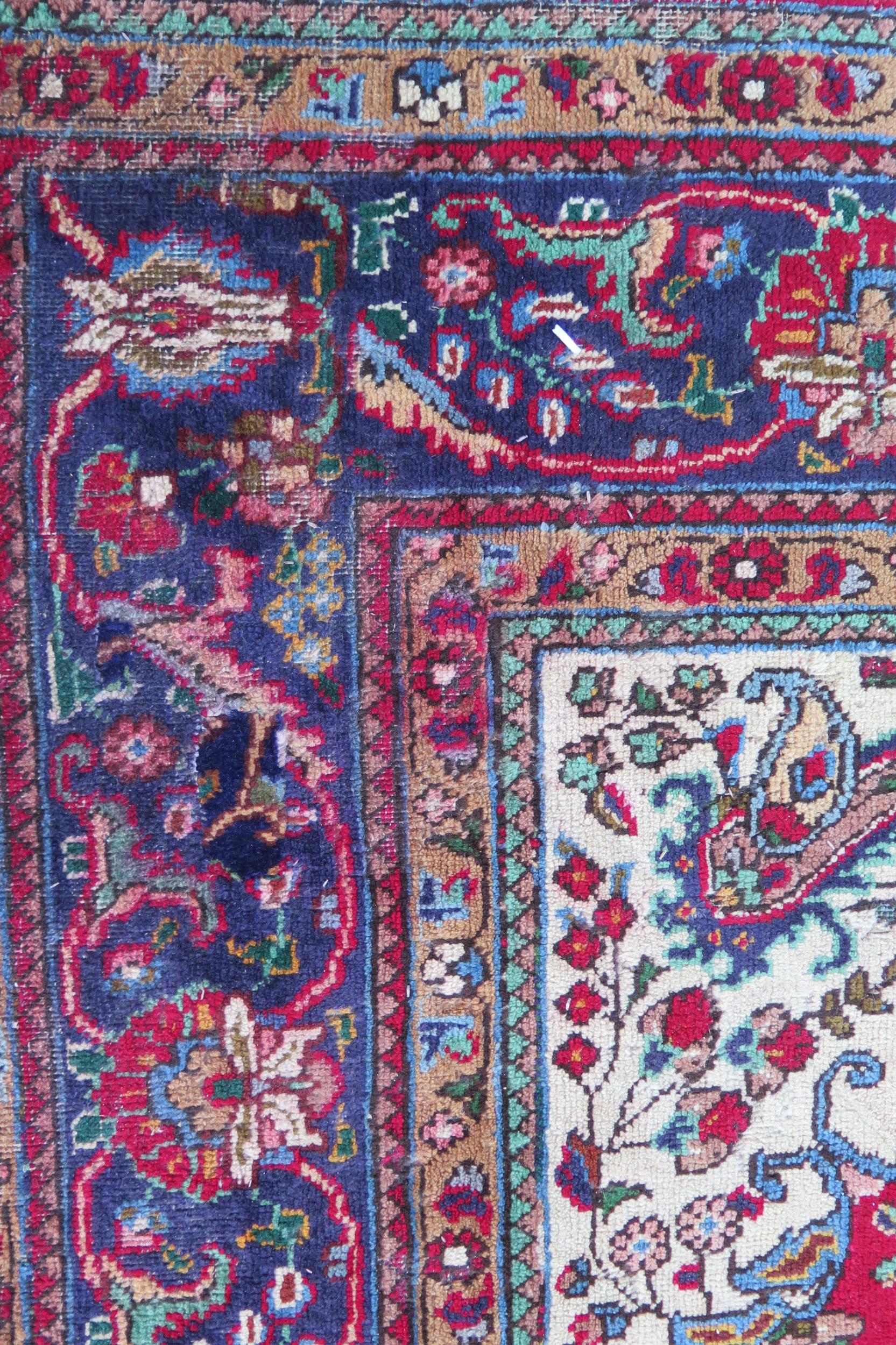 A 20th Century Kashan style wool carpet, blue central medallion, red field, cream spandrels, blue - Image 2 of 6