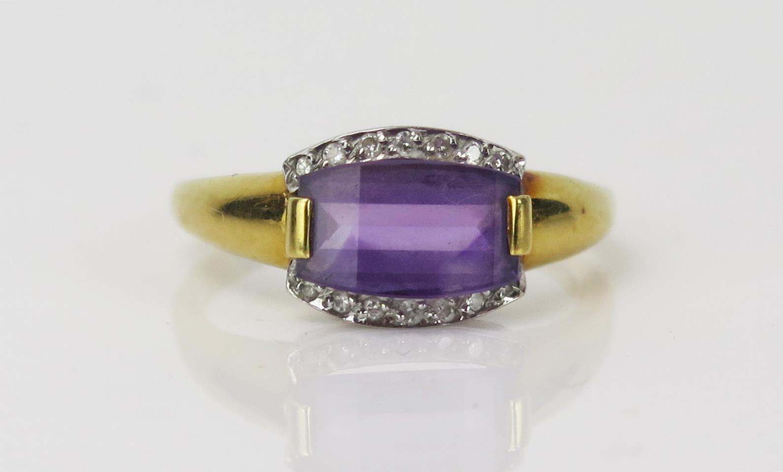 Amethyst and Diamond Dress Ring in an 18ct hallmarked setting, 10x7mm slice cut amethyst, size P.