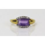 Amethyst and Diamond Dress Ring in an 18ct hallmarked setting, 10x7mm slice cut amethyst, size P.