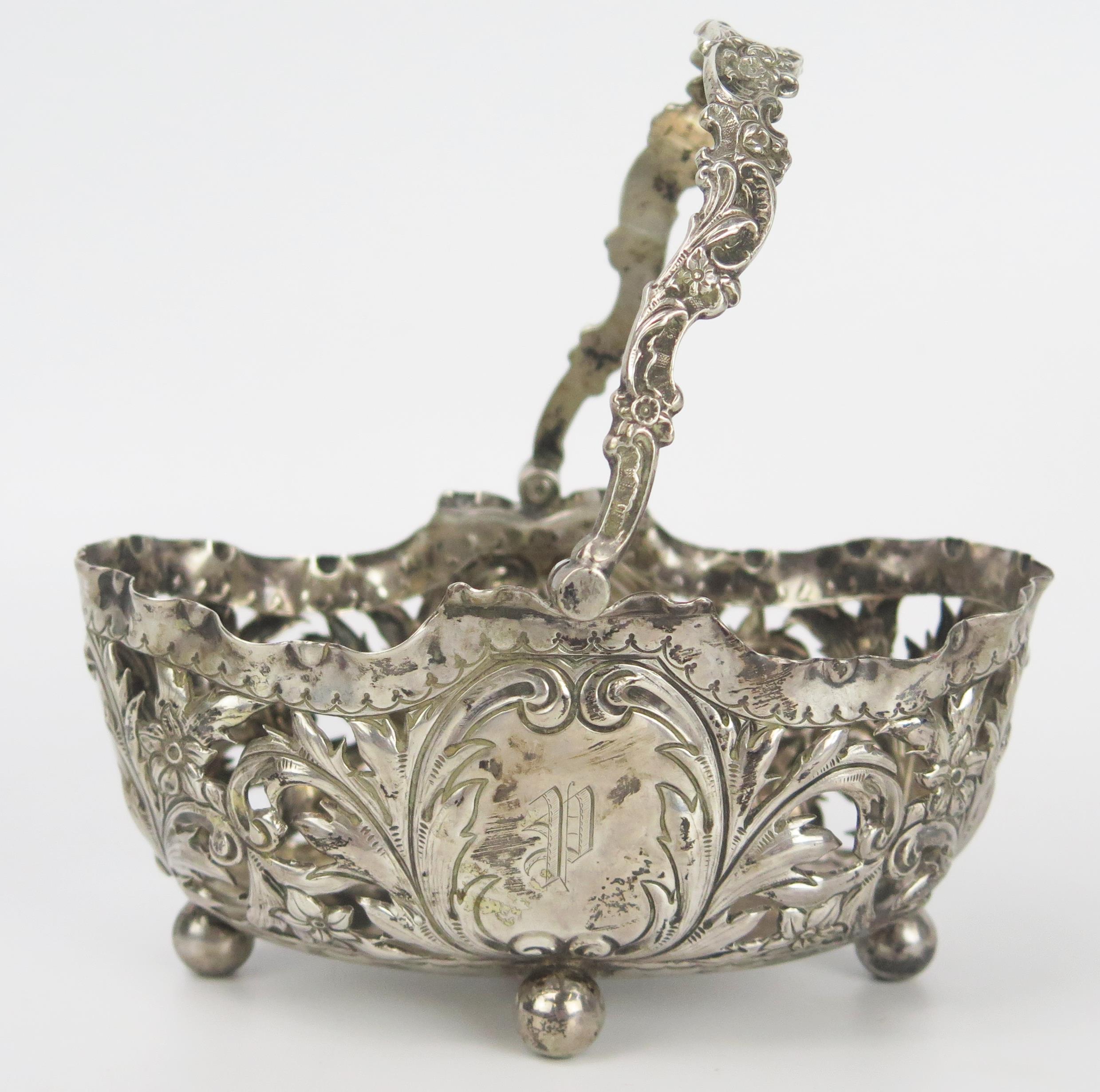 Victorian Silver, Embossed and Pierced Swing Handled Oval Basket, decorated with acanthus leaves and