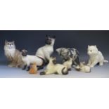 A collection of Beswick, Royal Doulton and other pottery models of cats, various sizes.