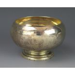 A George V silver sugar basin, maker Wakely & Wheeler, Dublin, 1918, of plain circular form,