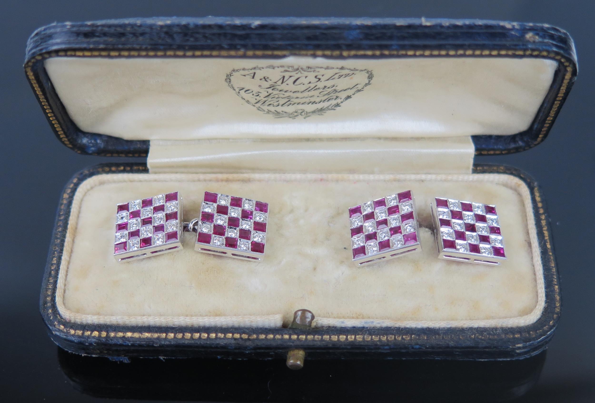 A Pair of Ruby and Diamond Cufflinks in unmarked precious white metal setting, boxed, 7.8g