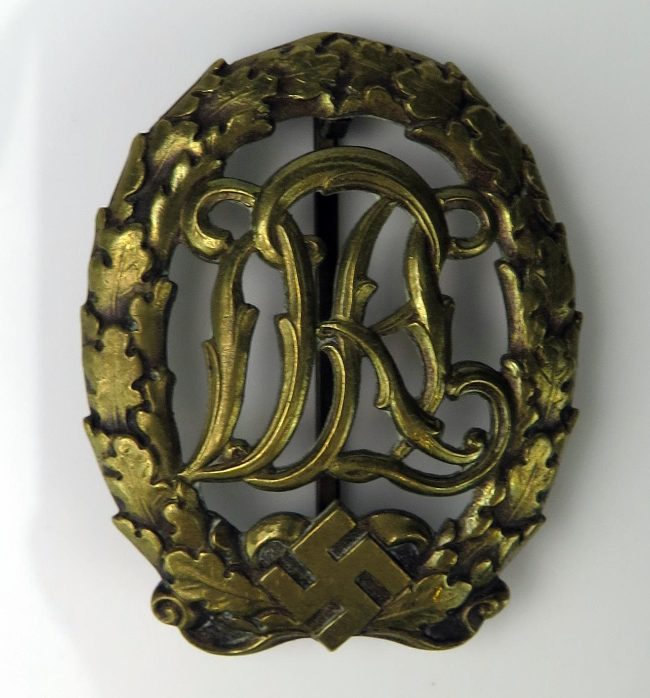 A Third Reich period sports badge , marked to the reverse DRGM 35269, Ernst L Muller Pforsheim,