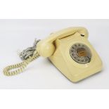 An ivory coloured telephone handset, with volume control to the earpiece, with flex.
