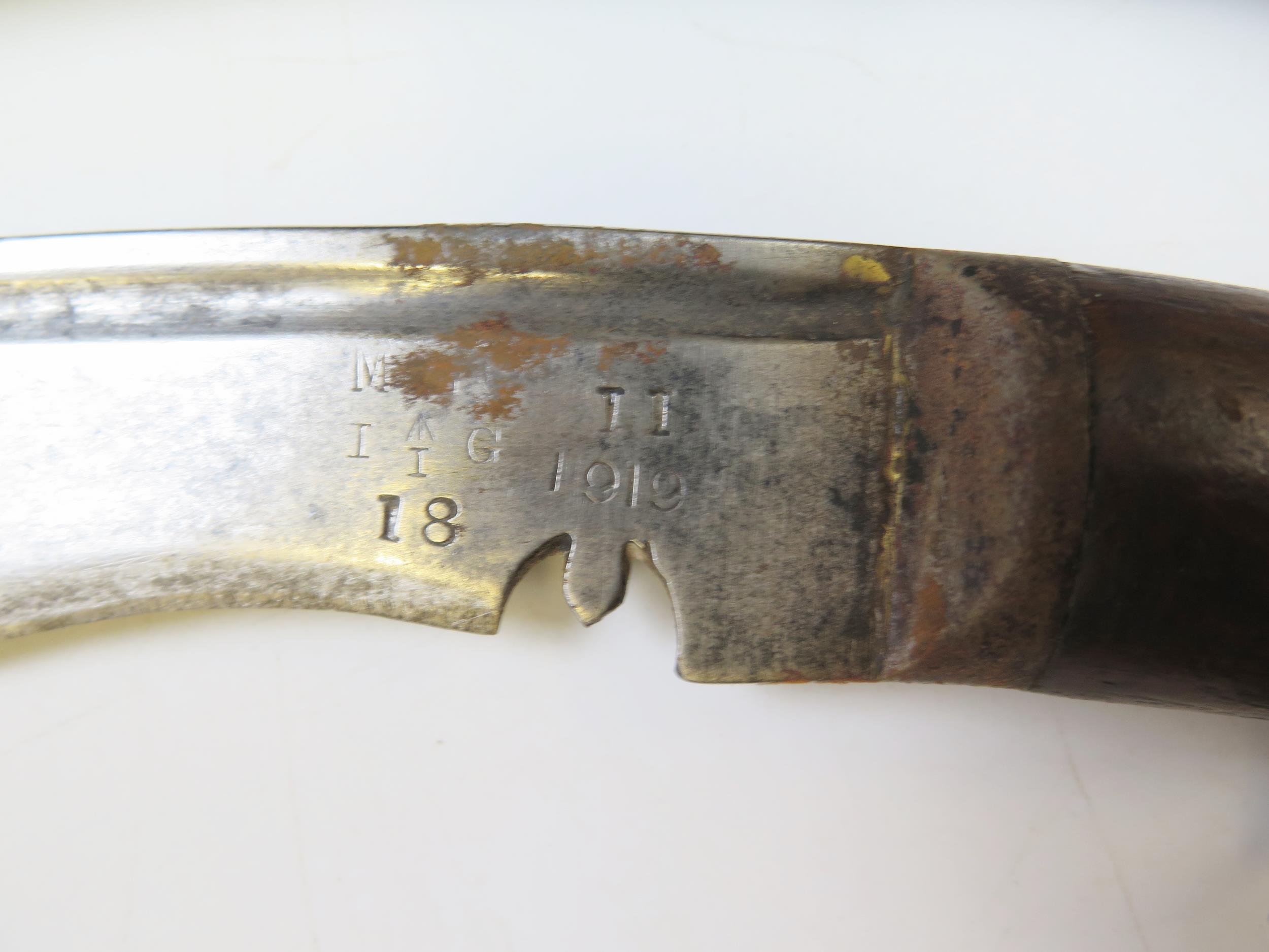 A British War Department issue kukri, with 35cm curved blade, stamped marks for 1919, contained in a - Image 2 of 2