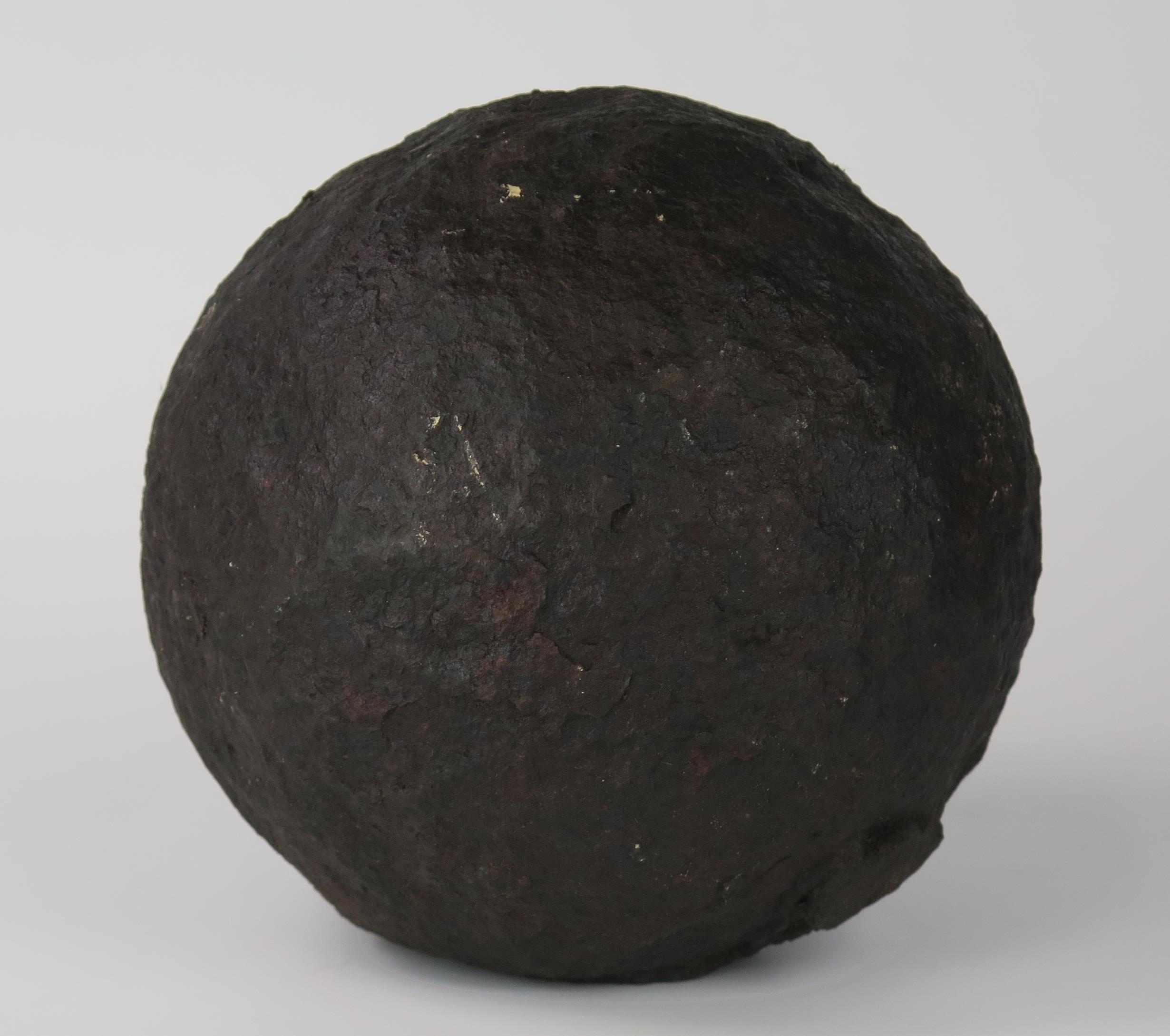 A 19th century cast iron cannon ball, 6ins diameter.